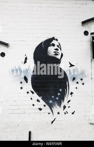 Ilhan Omar mural or graffiti art on a wall, Birmingham, Small Heath, UK Stock Photo