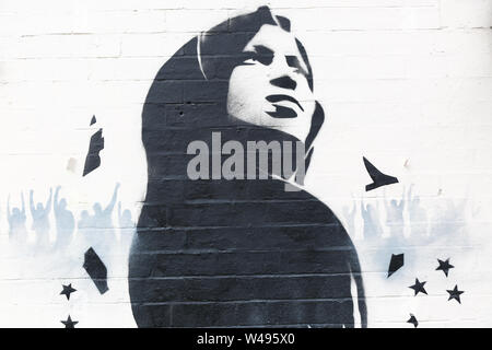 Ilhan Omar mural or graffiti art on a wall, Birmingham, Small Heath, UK Stock Photo