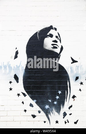 Ilhan Omar mural or graffiti art on a wall, Birmingham, Small Heath, UK Stock Photo