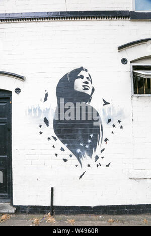 Ilhan Omar mural or graffiti art on a wall, Birmingham, Small Heath, UK Stock Photo