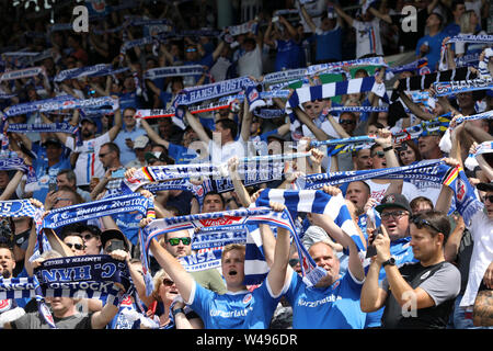 Rostock, Germany. 20th July, 2019. Soccer: 3rd league, 1st matchday, FC Hansa Rostock - Viktoria Köln in the Ostseestadion: Before the match starts, Hansa fans hold up their scarves and sing. Credit: Bernd Wüstneck/dpa-Zentralbild/dpa/Alamy Live News Stock Photo