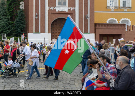 MOSCOW, RUSSIA - MAY 9, 2019: Immortal regiment procession in Victory Day. A man holding Azerbaijan flag Stock Photo