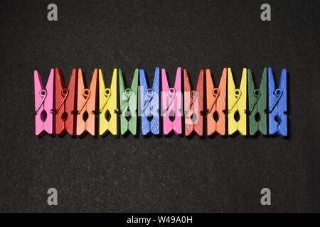 Top view of multicolored wooden photo clips. Stock Photo