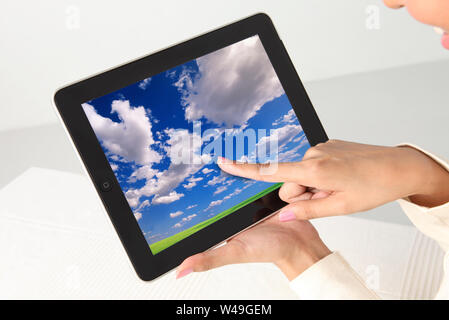 Woman hand using a digital tablet Stock Photo