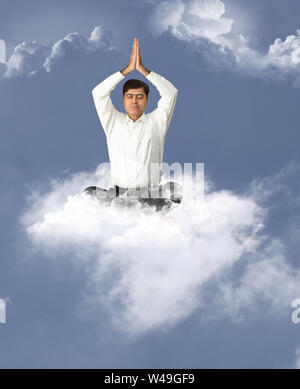 Businessman meditating Stock Photo