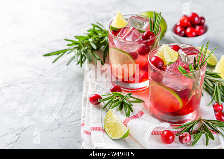 Cold season drink - cranberry and rosemary cocktail Stock Photo