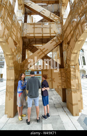 London, UK.  21 July 2019. Visitors view the inside of The People's Tower, a monumental cardboard structure, built by artist Olivier Grossetête aided by a local volunteers, which stands in Guildhall Yard.  Over 1,000 boxes have been used to build the 20m high artwork, inspired by the Guildhall building.  The four day construction process culminates in the structure being ceremonially torn down. Credit: Stephen Chung / Alamy Live News Stock Photo