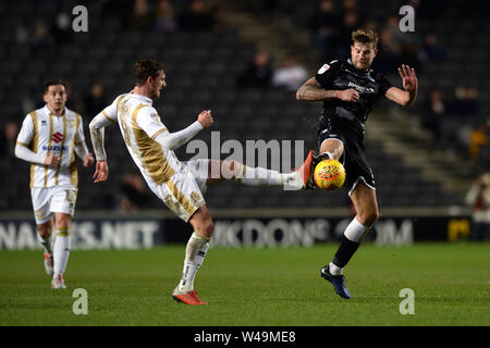 Harry Pell of Colchester United does battle with Alex Gilbey of Milton Keynes Dons - Milton Keynes Dons v Colchester United, Sky Bet League Two, Stadium MK, Milton Keynes - 22nd December 2018  Editorial Use Only - DataCo restrictions apply Stock Photo