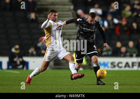 Luke Norris of Colchester United looks to get past Baily Cargill of Milton Keynes Dons - Milton Keynes Dons v Colchester United, Sky Bet League Two, Stadium MK, Milton Keynes - 22nd December 2018  Editorial Use Only - DataCo restrictions apply Stock Photo