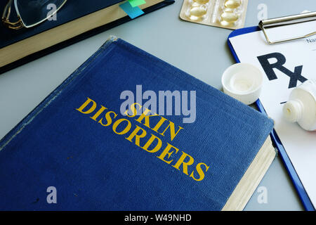 Skin disorders and prescription form in a clinic. Stock Photo