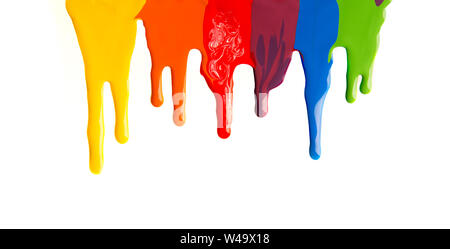 Colorful paint stains dripping from the top on white background Stock Photo