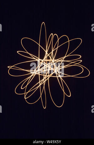 Light trails and patterns against black background Stock Photo