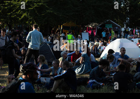 London, UK. 15th July 2019. Extinction Rebellion activists at the climate action group's protest iarriving at their base camp at Waterloo Millennium Green from the Royal Courts of Law on the Strand, London. Credit: Joe Kuis / Alamy News Stock Photo