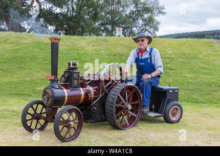 Grantown East, UK. 21 July 2019.  The first steam rally held at Grantown East, Morayshire, UK proved popular with a steam engine and vintage enthusiasts as well as spectators. Picture of MARTIN JOHNSON from Boat of Garten on his 1/3 scale replica of a 1906 6HP Burrell traction engine Credit: Findlay/Alamy Live News Stock Photo