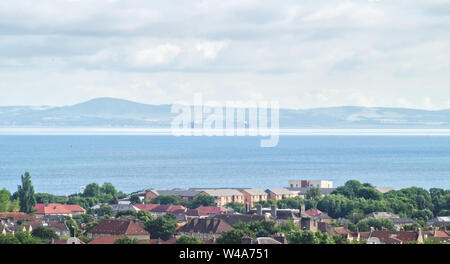 A view of the Coast of fife and two oil rigs with a panomara of the City of Edinburgh in the foreground Stock Photo