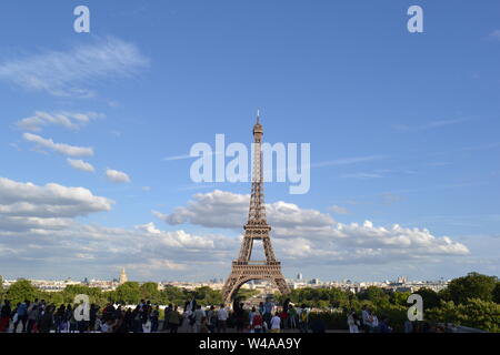 Paris/France - August 18, 2014: Beautiful panoramic view to the Eiffel Tower from Trocadero gardens viewpoint with tourists admiring the city. Stock Photo