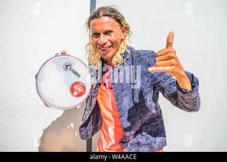 Oeiras, Brazil - Circa July 2019: Street artist with a tambourine in the center of Oeiras, Piaui Stock Photo