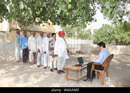 Rural people getting money Stock Photo