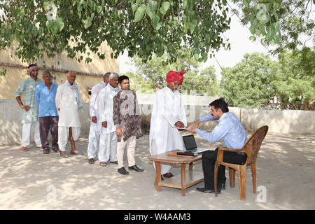 Rural people getting money Stock Photo