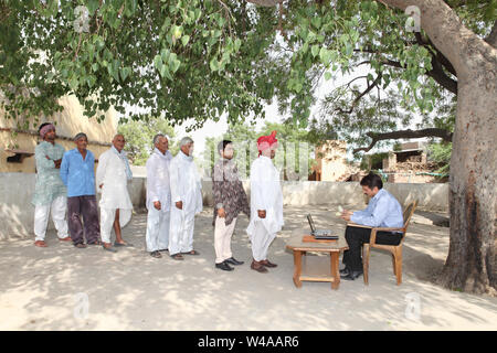 Rural people getting money Stock Photo