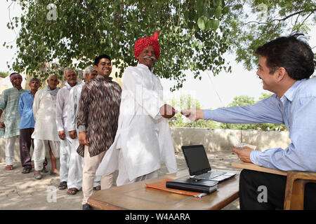 Rural people getting money Stock Photo