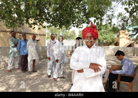 Rural people getting money Stock Photo