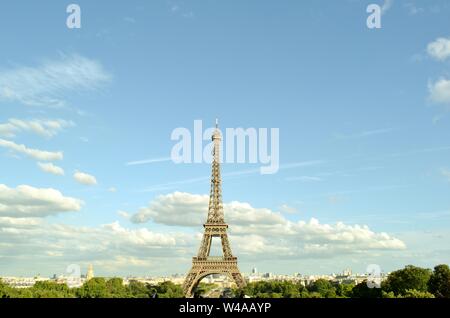 Paris/France - August 18, 2014: Beautiful panoramic view to the Eiffel Tower from Trocadero gardens viewpoint with tourists admiring the city. Stock Photo