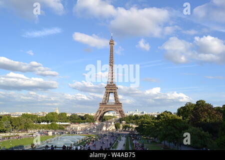 Paris/France - August 18, 2014: Beautiful panoramic view to the fountain of Warsaw and the Eiffel Tower from Trocadero gardens viewpoint. Stock Photo