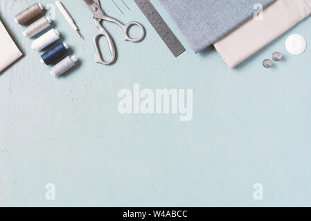 Blue textured background with sewing tools, copy space Stock Photo