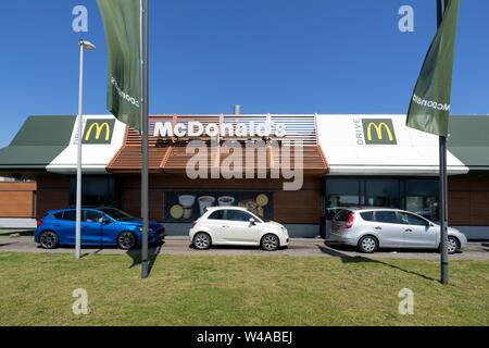 McDonald's McDrive drive-through service. McDonald's is an