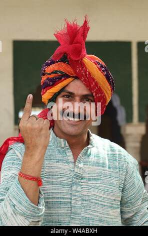 Portrait of a man pointing upward and smiling Stock Photo