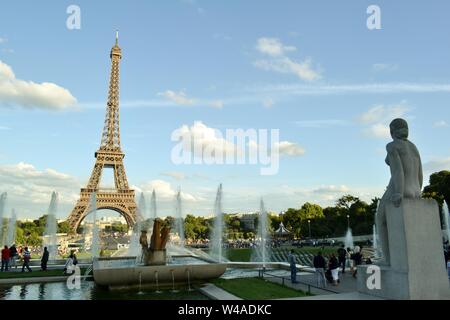 Paris/France - August 18, 2014: View to the statue called Woman, la Femme, of the fountain of Warsaw and the Eiffel Tower in the background. Stock Photo