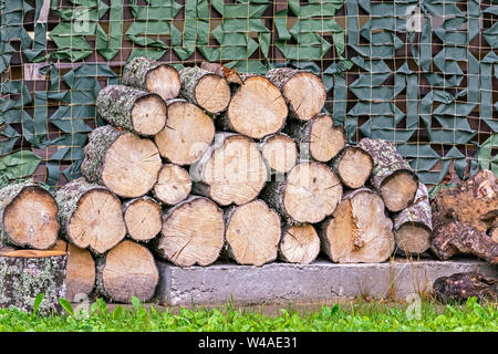 Aspen logs, neatly laid in a crib. Stock Photo