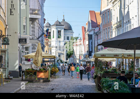 Tallinn, Estonia, June 28: Tourists get acquainted with the sights on the street of Old Tallinn, June 28, 2019. Stock Photo