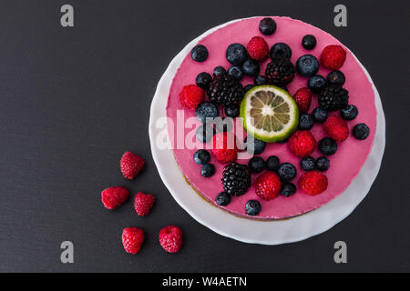 Raw vegan cake, homemade with berry and lemon. Stock Photo