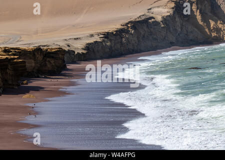 Red sand beach (Playa roja) in Paracas National Reserve in Southern Peru on the Paracas Peninsula Stock Photo