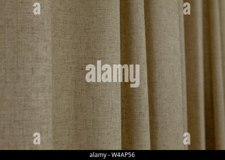 dense textile curtain background or texture with folds. Stock Photo