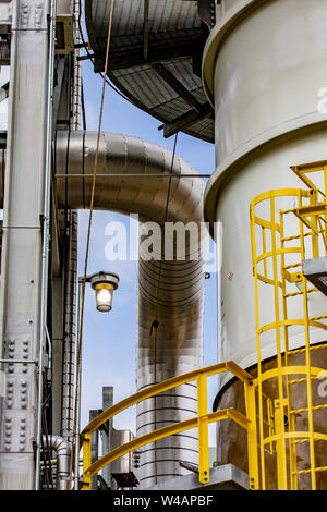 Pipe and tower in a refinery Stock Photo