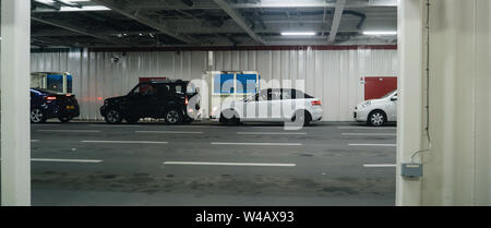 Havenplein, Netherlands - Aug 18, 2018: Cars entering ferry boat in the TESO Ferry Port with destination Den Hoorn Texel Island Stock Photo