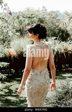 Bride smirking during First Look on Wedding day Stock Photo