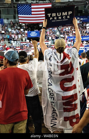 Supporters cheer as President Donald Trump speaks during a campaign ...