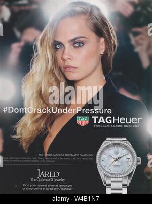 poster advertising TAG Heuer watch with Cara Delevingne in