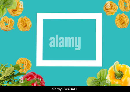 Top view of raw ingredients of taliatele pasta on creative cyan blue background Stock Photo