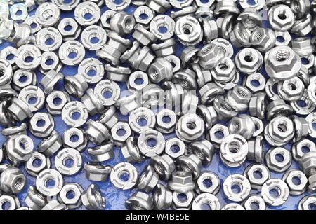 small bolts and nuts by manufacturing process ; tapping Stock Photo