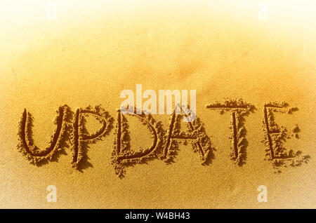 the inscription on the heat yellow sand  update Stock Photo