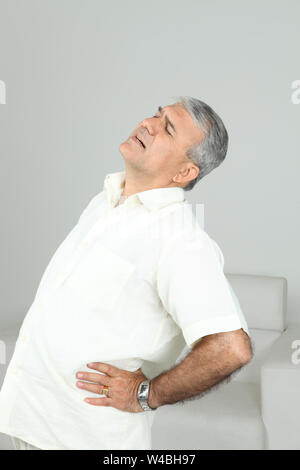 Man suffering from lower back pain Stock Photo