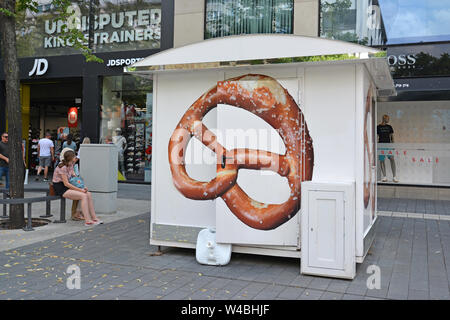 Mannheim, Germany - July 2019: Mobile food stand selling traditiona German baked bread product called 'Pretzel' in streets Stock Photo