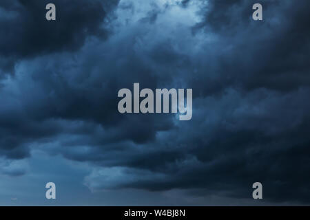Texture of the sky covered with dark rain clouds Stock Photo