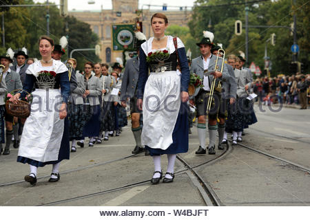 The Oktoberfest parade takes place in Munich every year and sees thousands of people dressed in traditional clothing march through the town. Stock Photo