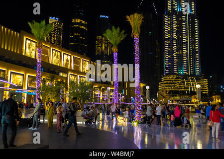 Dubai, UAE - November 29, 2018: Downtown Dubai district. View of the central square near the Dubai Mall in the evening. Stock Photo
